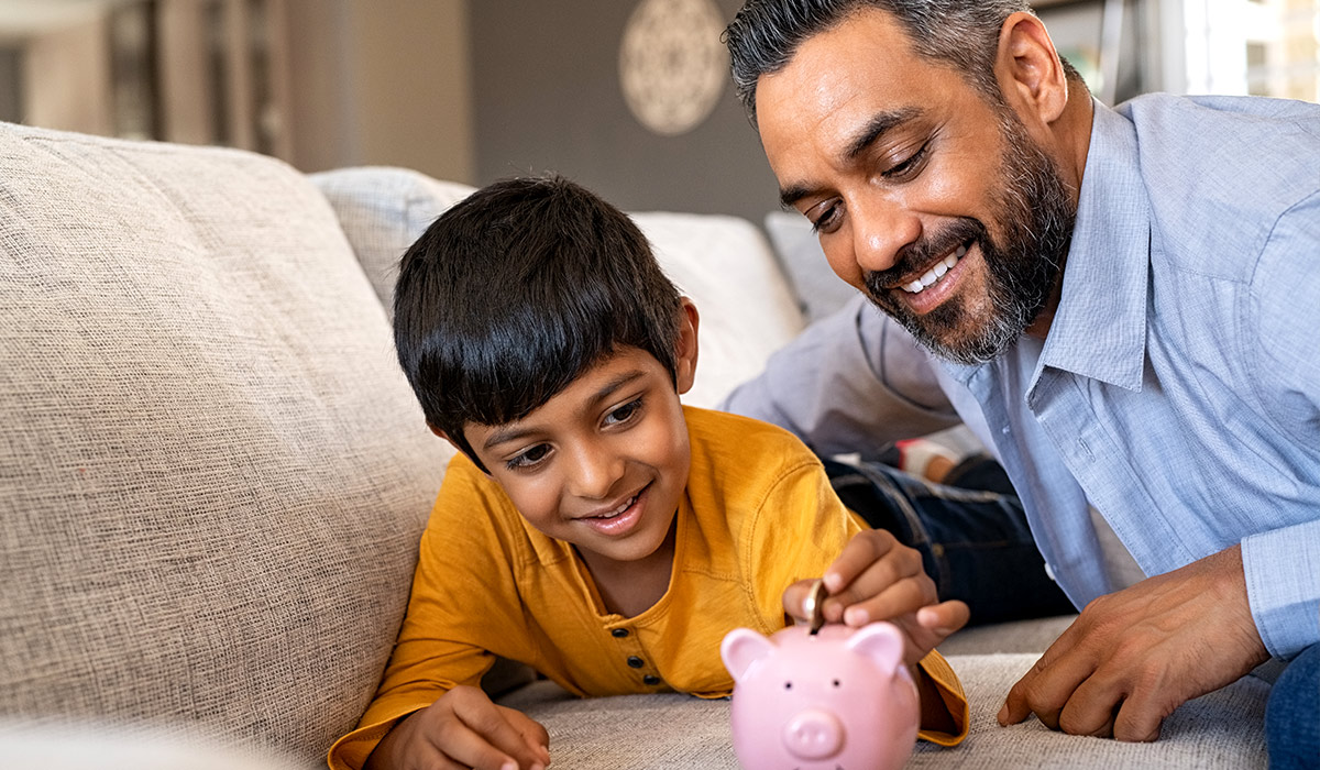 Father and Son with Piggy Bank - Xact Loans
