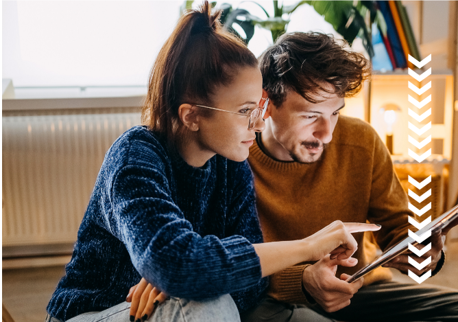 Man & Woman Reviewing Xact Loan Application on Tablet